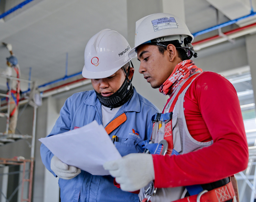 Workers viewing workers comp rates